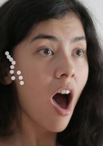 massage around the ear and jaw-min